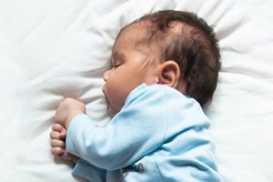 Close-up of a newborn baby sleeping.